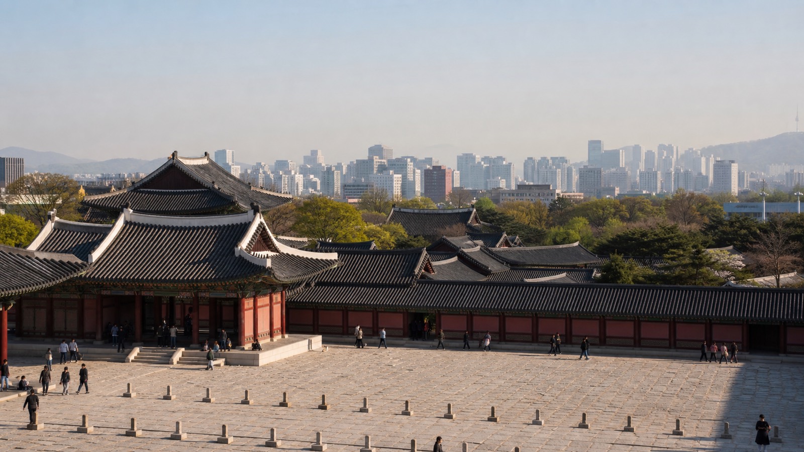 Palace roofs below the Seoul skyline